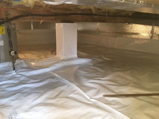 This image shows how much the the CleanSpace product brightens up the crawl  space. You can also see our SilverGlo Product which is used for crawl space insulation and air sealing. The SilverGlo is sitting above the CleanSpace on the walls of the crawl space. Both of these products work together to seal the space and keep it dry.