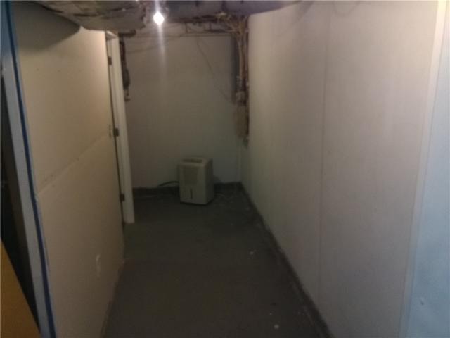 <p>The plastic paneling prevents moisture from coming in through the cinderblock, into the basement.</p>