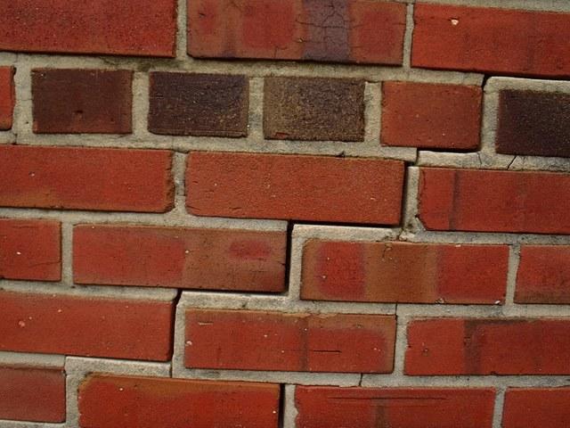 Large cracks in the brick exterior