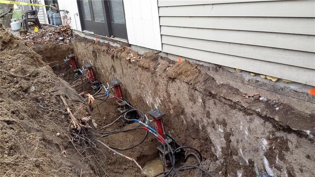 Helical Piers Being Installed