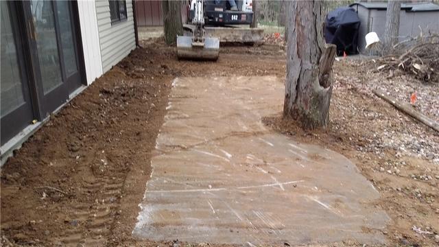 <p>The removal of the top layers of soil show the difference in elevation between the home and outdoor deck.</p>