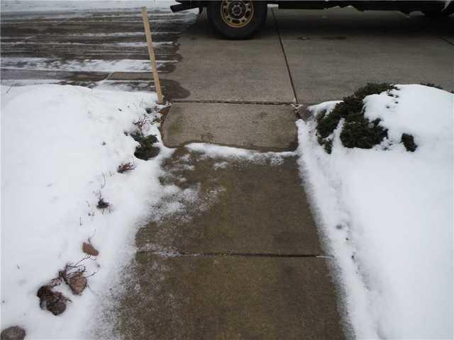 Tilting, Sinking Grand Haven Sidewalk