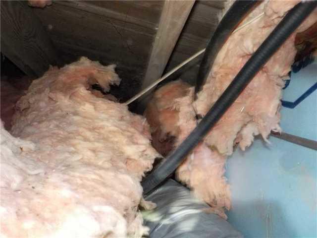 Fallen Fiberglass Insulation in Crawl Space