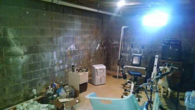 You can see on the walls of this basement that there are signs of moisture. Not  place you want to workout or hang out.