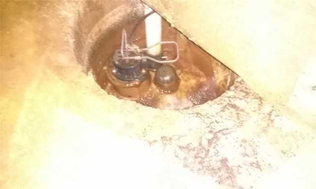 Old, Overworked Sump Pump in St. Johns Basement