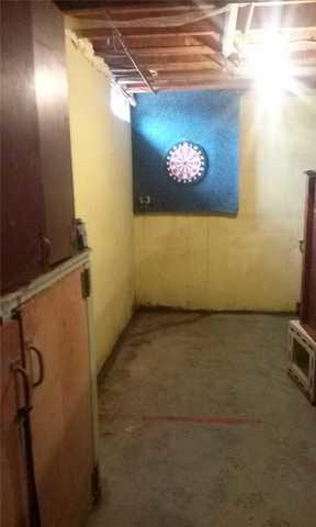 Leaking Basement Corner Makes Dart Games a Bummer