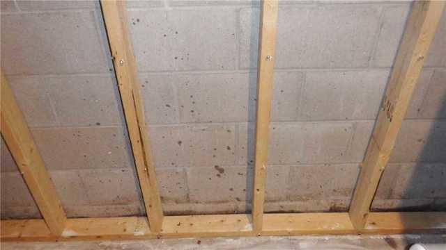 Water Damage at Base of Block Wall