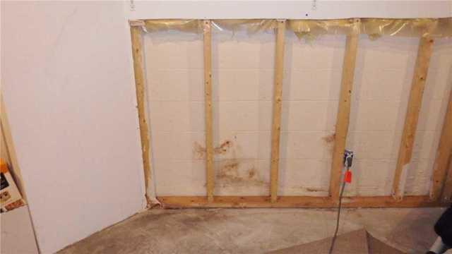 Drywall Cut Back to Reveal Leaking Wall