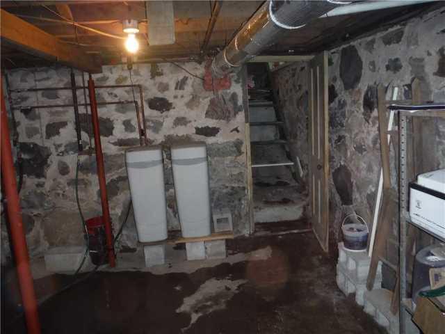 Standing Water and Water Damage in Scottville Basement