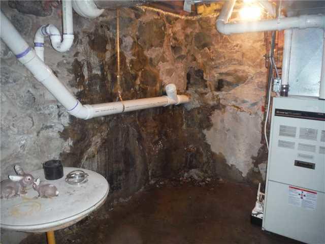 Heavy Water Damage on Fieldstone Wall