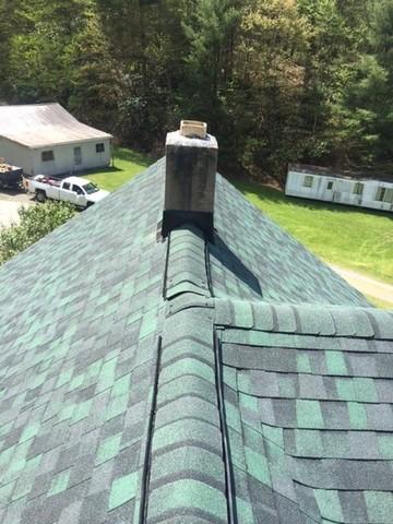 We had to update the chimney's flashing and surrounding shingles to prevent any further leaks!