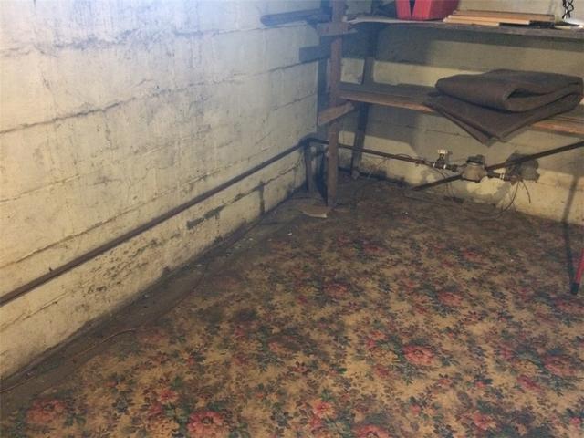 Water Damage on Basement Wall and Floor