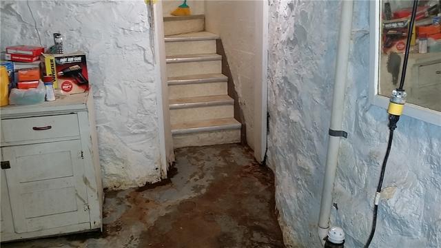 The area at the foot of the stairs was particularly nasty. We actually replaced the bottom few stairs because of the water damage.