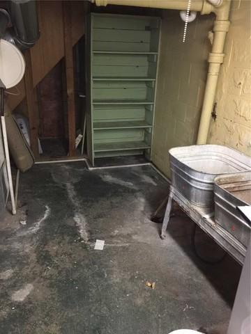 Here we have a floor covered in mold and efflorescence- the white residue left behind when standing water dissolves the natural salts in concrete. While the latter is largely just a nuisance, longstanding issues