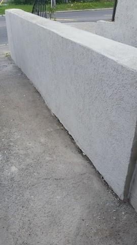 Retaining wall after repairs and coating.