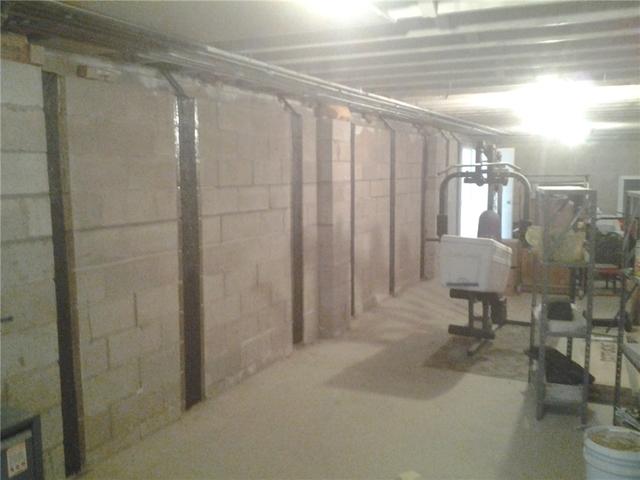 Carbon Straps Adhered to Wall in Wayne