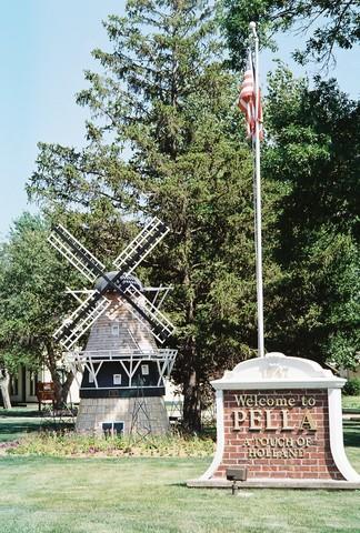 <p>As you enter the city, you are greeted by a "Welcome to Pella" sign and a Windmill.</p>