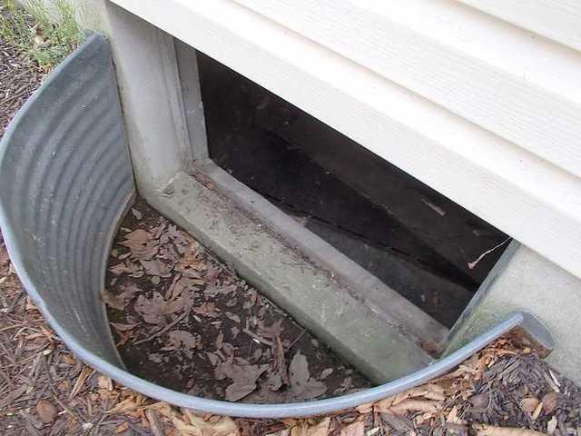 Old metal shroud around the crawlspace door