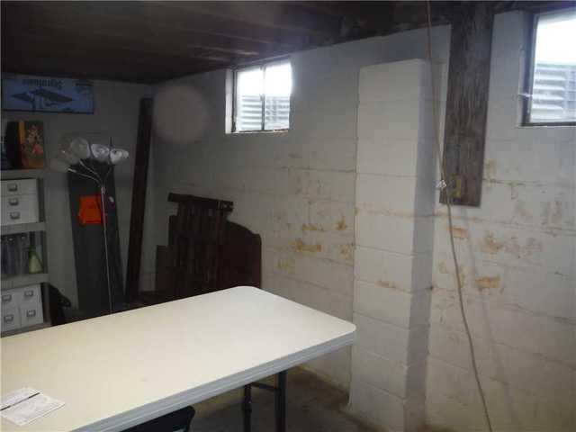 Closeup of Peeling Paint on Bowed Wall