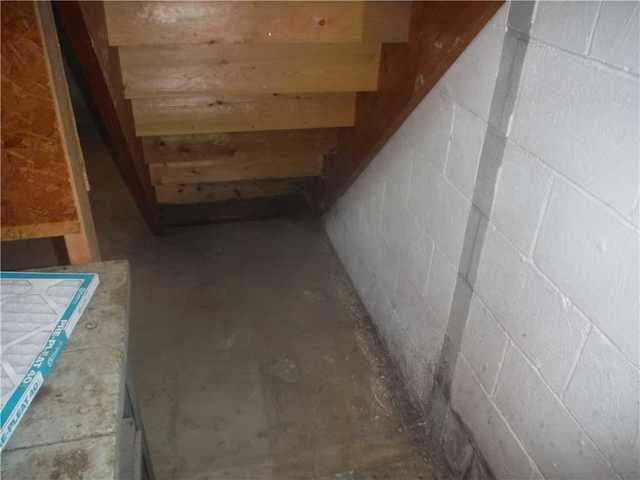 Water Damage Under Stairs