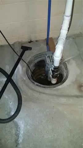 The sump pump was fine - we didn't need to replace it - but the basement needed a way to actually get the water to the pump instead of relying on gravity (which clearly isn't working).