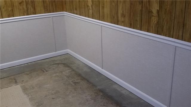 By installing water resistant panels in place of the ruined wood paneling, we can give the basement a clean look without the risk of future damage.