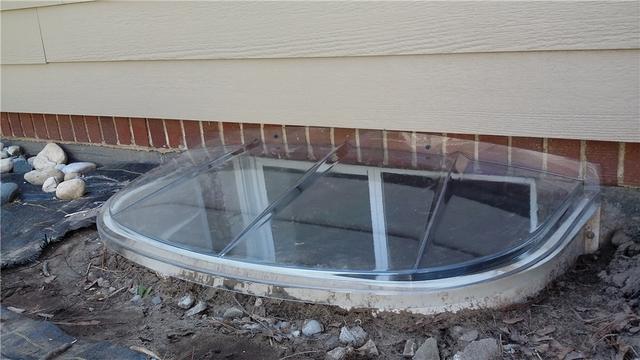 Egress Window Lid Protects Window Well