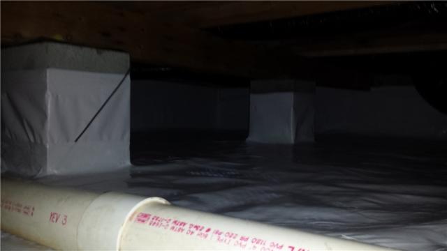 Here is an after picture of the crawl space once the liner was installed.