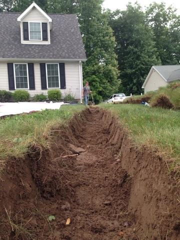 Our crew removed the dirt needed to give the discharge line pitch and allow for the water to properly flow away from the home.