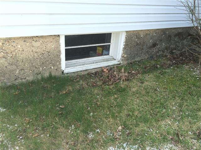 Water Damage Surrounding Basement Window