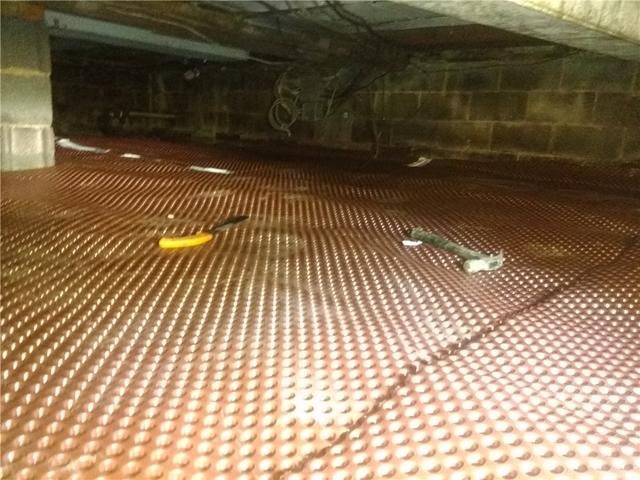 <p>Quality 1st Basement Systems installed drainage matting on the floor of the crawl space. The drainage matting redirects moisture to a sump pump.</p>