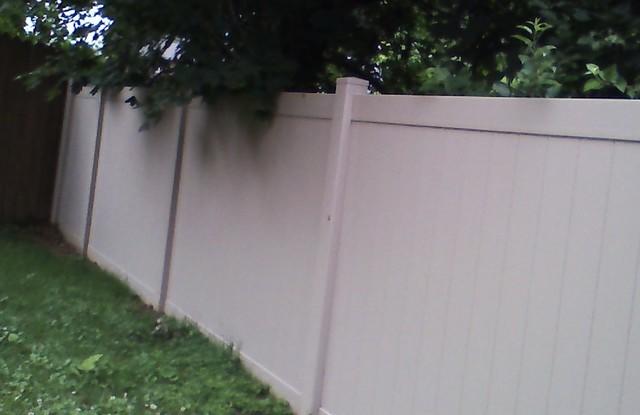 Installed vinyl fence.