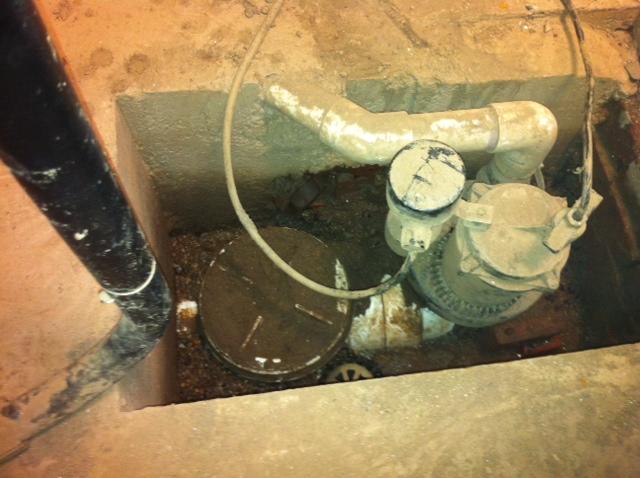 Old antiquated sump pump in West Hartford, CT