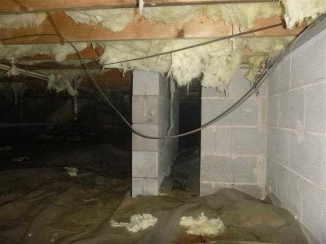 The insulation falling from the top of the crawl space is filled with moisture. When insulation is filled with moisture it begins to fall because it is too heavy to hold all the water.