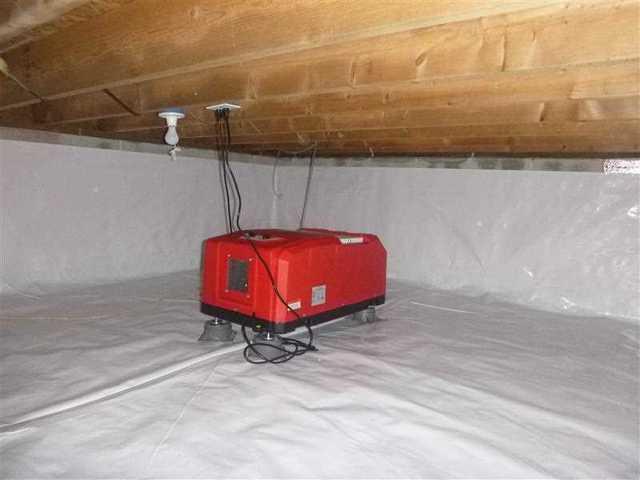 The dehumidifier has been installed to keep the moisture under control in the crawl space.