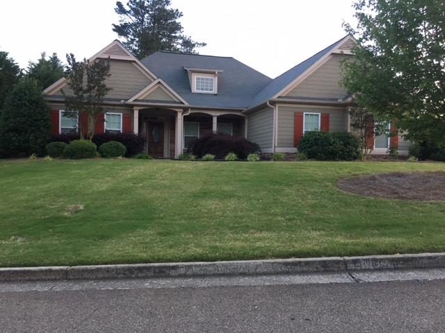 This picture shows the finished product, we installed Owens Corning Supreme 3-Tab shingles and upgraded the gutters to a 6" gutter system.