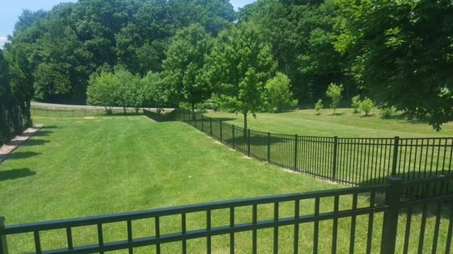 Black aluminum fence install.