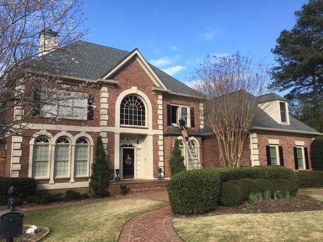 Our installers are removing the old windows in this picture.