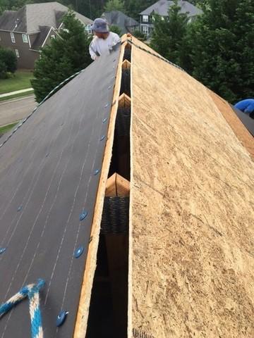 This picture shows how the crew cut the ridge opening for the ridge vent installation. We upgraded this customer to a balanced intake and outtake ventilation system to ensure proper ventilation throughout the house.