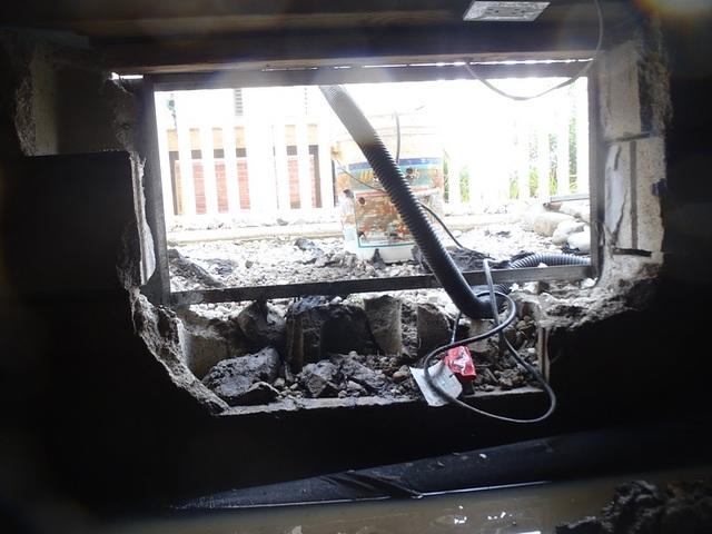 Broken foundation blocks on the crawlspace entry