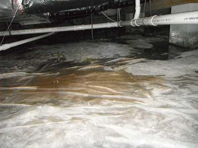 The water is starting to fill up in the crawl space, which means the homeowners need a water drainage mat.