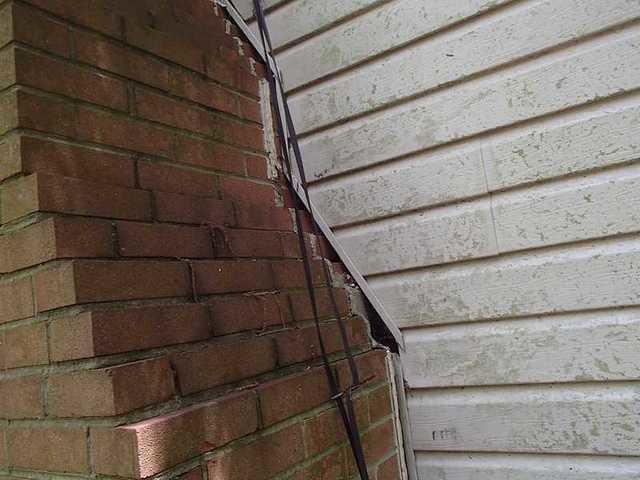Chimney breaking away from a Millington home