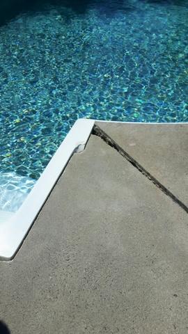 Trip hazard removal. Potential trip hazard at the edge of pool.