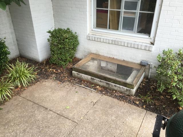 Here's the exterior entrance to this Owensboro, KY home.  You can see that it's constructed of 2x4s and plexi glass.  The homeowners have noted that it leaks.

Daniel Crews, from Healthy Spaces, came out to design a custom waterproofing solution for these homeowners.