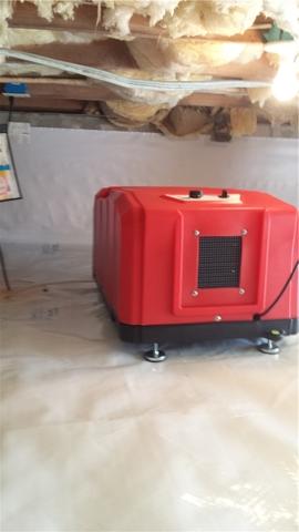 The dehumidifier has been installed in the crawl space to control the moisture in the air.