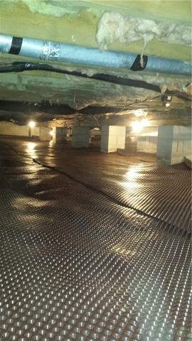 The water drainage mat has been placed in the crawl space to control the water and keep the are DRY!