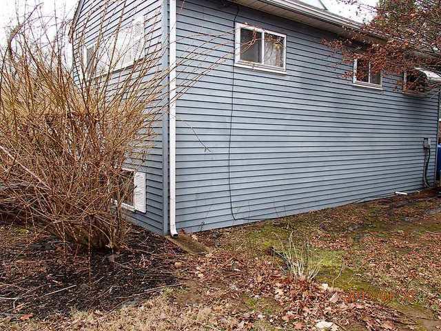 Short downspout on the back corner of the house