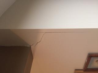 Cracks began appearing on interior walls as the home settled.