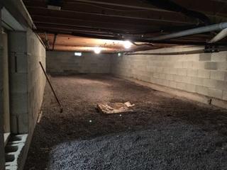 You can see this crawlspace floor is dirt and the walls have no insulation.