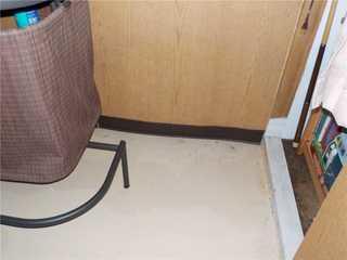 Water damage can be difficult to spot in a finished basement, but notice the wave in the wall panels - that's from getting wet and drying out repeatedly.